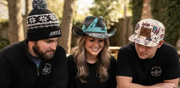 Custom printed hat sitting on a beach.